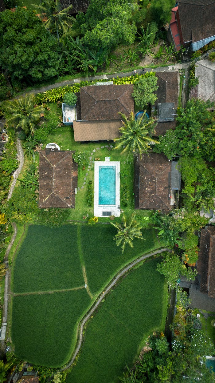 Aerial View of a House with a Swimming Pool
